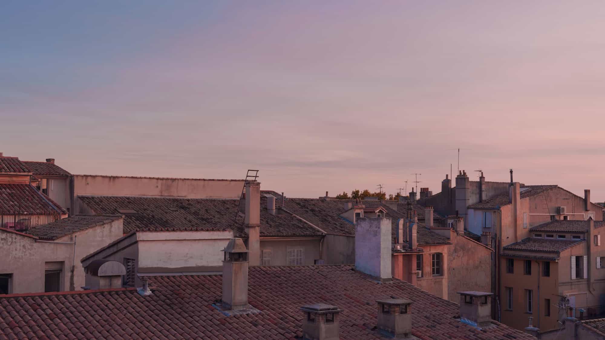 Terracotta rooftops of Toulouse at golden hour